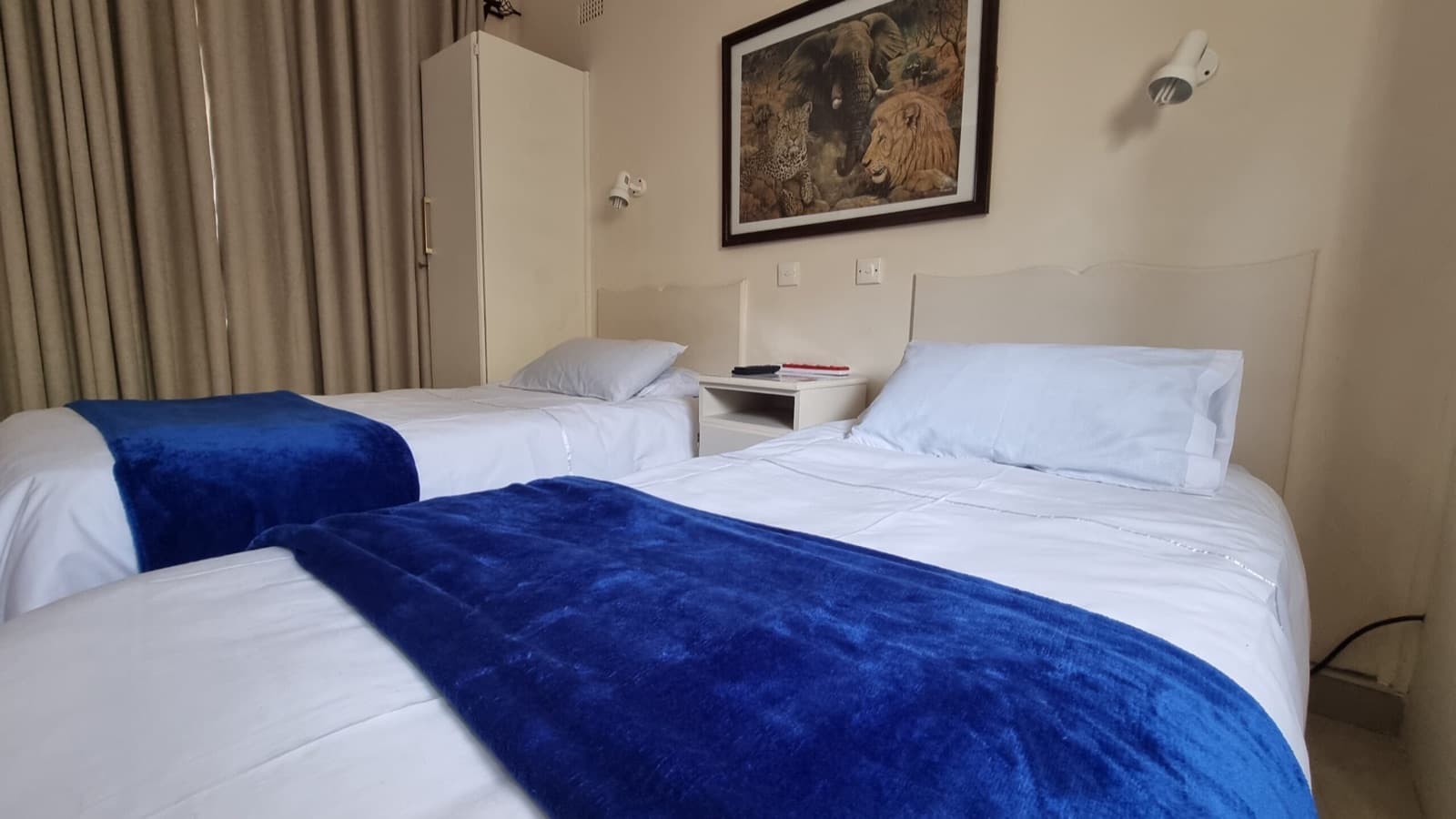 Twin room beds with fresh white linen